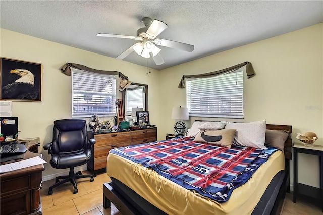 13814 Lavender Ave, Hudson, FL 34667 - bedroom featuring an office area, light tile patterned flooring, a ceiling fan, and a textured ceiling