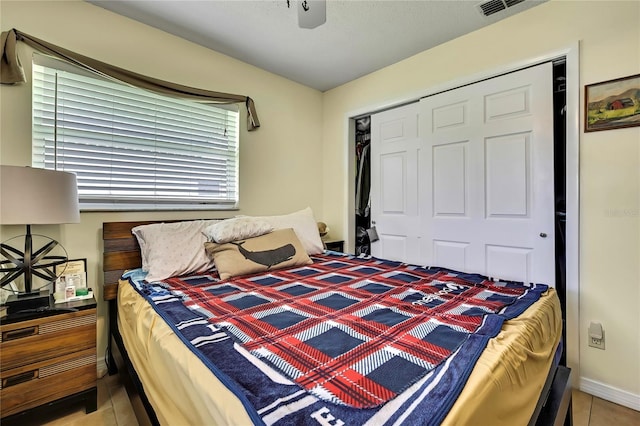 13814 Lavender Ave, Hudson, FL 34667 - bedroom featuring a closet, tile patterned floors, and ceiling fan