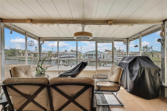 13814 Lavender Ave, Hudson, FL 34667 - sunroom / solarium featuring tile patterned floors and a water view