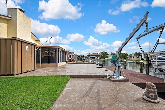 13814 Lavender Ave, Hudson, FL 34667 - dock featuring a water view, a yard, a residential view, and a patio area