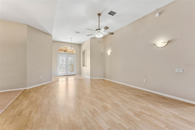 5309 Spectacular Bid Dr, Wesley Chapel, FL 33544 - empty room featuring light wood-type flooring, ceiling fan, and arched walkways