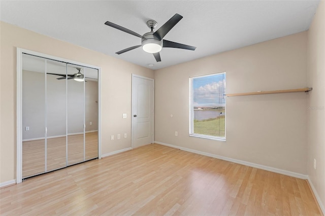 5309 Spectacular Bid Dr, Wesley Chapel, FL 33544 - unfurnished bedroom with wood finished floors, ceiling fan, and a closet