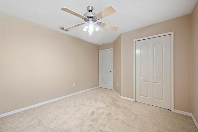 5309 Spectacular Bid Dr, Wesley Chapel, FL 33544 - unfurnished bedroom featuring light colored carpet, a closet, and ceiling fan