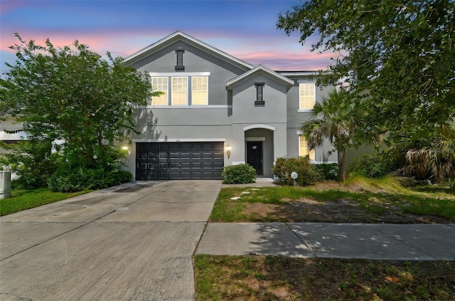 11541 Tangle Branch Ln, Gibsonton, FL 33534 - view of front of property featuring a garage, concrete driveway, and stucco siding