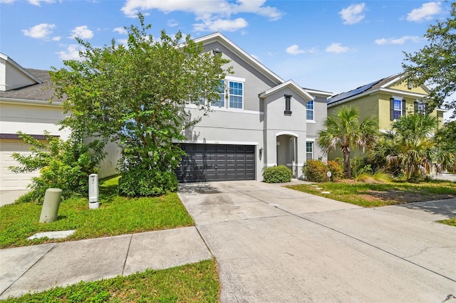 11541 Tangle Branch Ln, Gibsonton, FL 33534 - view of front of home featuring stucco siding, an attached garage, and concrete driveway