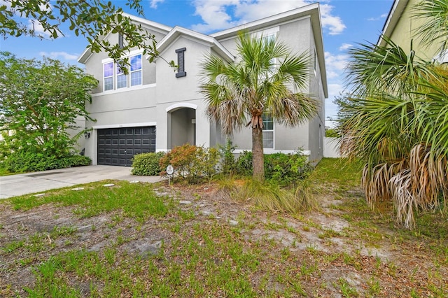11541 Tangle Branch Ln, Gibsonton, FL 33534 - view of front facade featuring stucco siding, an attached garage, and driveway