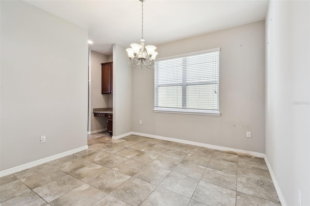 11541 Tangle Branch Ln, Gibsonton, FL 33534 - unfurnished room featuring a chandelier and built in desk