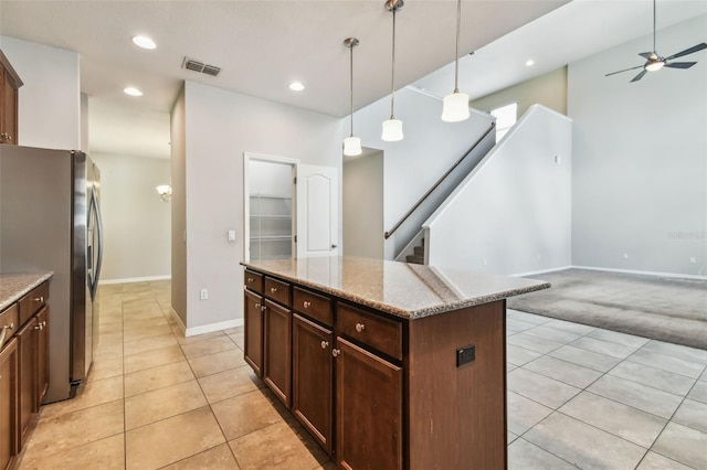 11541 Tangle Branch Ln, Gibsonton, FL 33534 - kitchen featuring freestanding refrigerator, light tile patterned floors, a ceiling fan, light stone counters, and recessed lighting