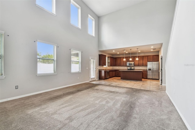11541 Tangle Branch Ln, Gibsonton, FL 33534 - unfurnished living room with light colored carpet and a high ceiling