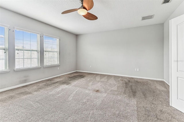 11541 Tangle Branch Ln, Gibsonton, FL 33534 - carpeted empty room featuring a ceiling fan and a textured ceiling