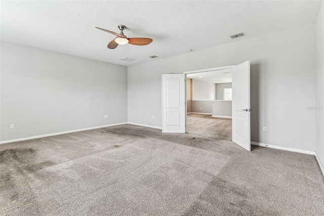 11541 Tangle Branch Ln, Gibsonton, FL 33534 - carpeted spare room with a ceiling fan and a textured ceiling