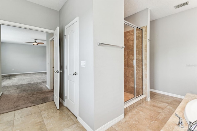 11541 Tangle Branch Ln, Gibsonton, FL 33534 - bathroom featuring ceiling fan, a shower stall, tile patterned flooring, and a bathtub