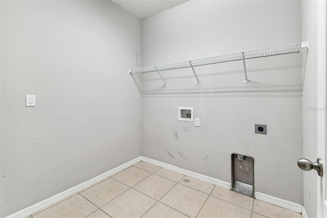 11541 Tangle Branch Ln, Gibsonton, FL 33534 - laundry room featuring washer hookup, hookup for an electric dryer, and light tile patterned flooring