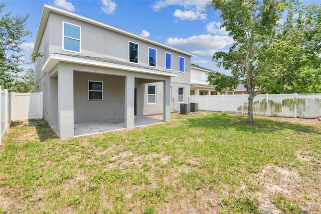 11541 Tangle Branch Ln, Gibsonton, FL 33534 - rear view of house with a patio area, stucco siding, and a fenced backyard