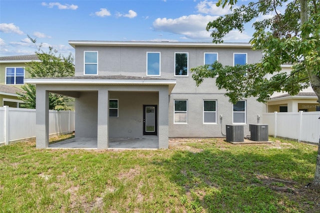 11541 Tangle Branch Ln, Gibsonton, FL 33534 - back of property featuring a patio, stucco siding, and a fenced backyard