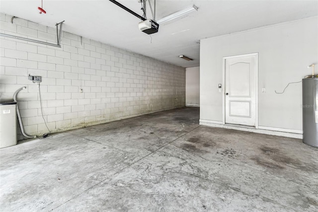 11541 Tangle Branch Ln, Gibsonton, FL 33534 - garage featuring a garage door opener, water heater, and concrete block wall