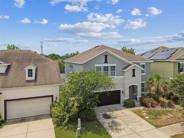 11541 Tangle Branch Ln, Gibsonton, FL 33534 - traditional-style home with concrete driveway, stucco siding, roof with shingles, and a garage