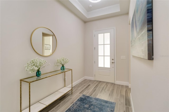 2132 Limestone Trl, Kissimmee, FL 34747 - foyer with wood tiled floors and a tray ceiling