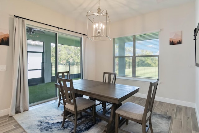 2132 Limestone Trl, Kissimmee, FL 34747 - dining room with wood finish floors and a chandelier