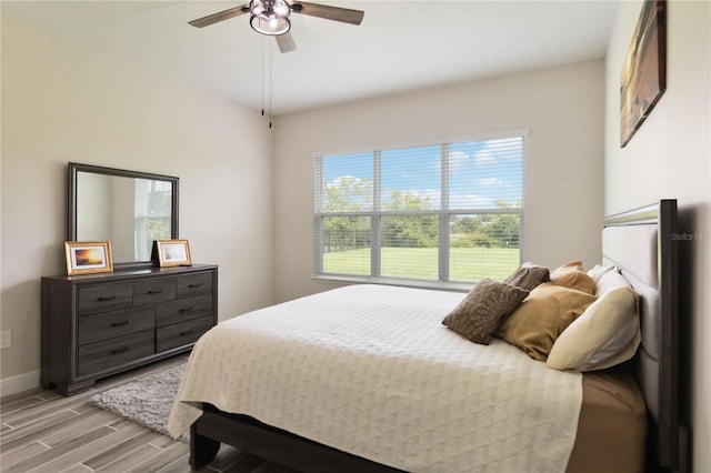 2132 Limestone Trl, Kissimmee, FL 34747 - bedroom with light wood-type flooring and a ceiling fan