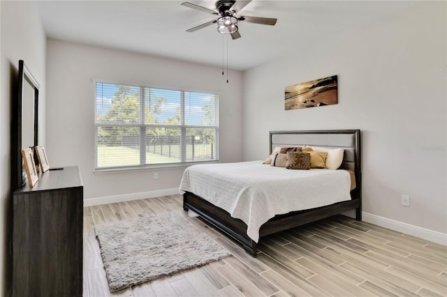 2132 Limestone Trl, Kissimmee, FL 34747 - bedroom featuring light wood finished floors and a ceiling fan