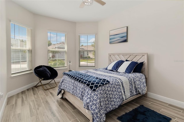 2132 Limestone Trl, Kissimmee, FL 34747 - bedroom with wood finish floors and a ceiling fan