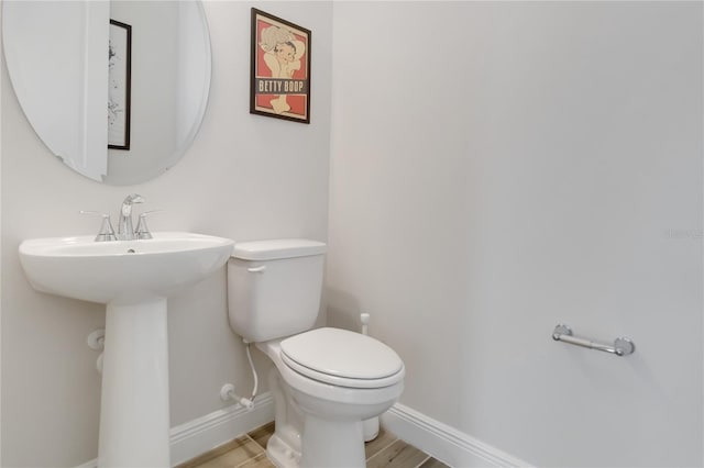 2132 Limestone Trl, Kissimmee, FL 34747 - bathroom with toilet and wood finished floors