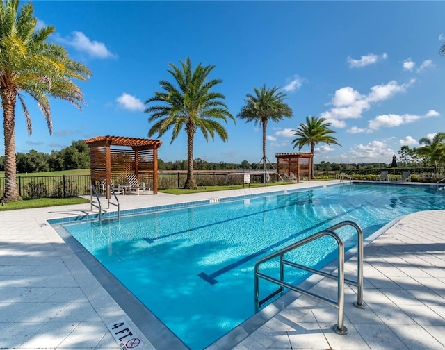 2132 Limestone Trl, Kissimmee, FL 34747 - community pool featuring a pergola and a patio area