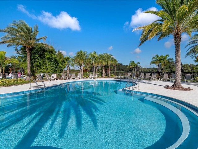 2132 Limestone Trl, Kissimmee, FL 34747 - community pool featuring a patio area