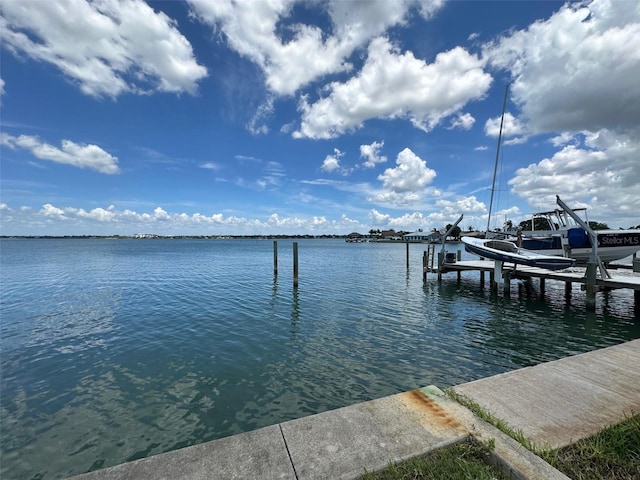 413 Midway Is, Clearwater Beach, FL 33767 - dock area with a water view and boat lift
