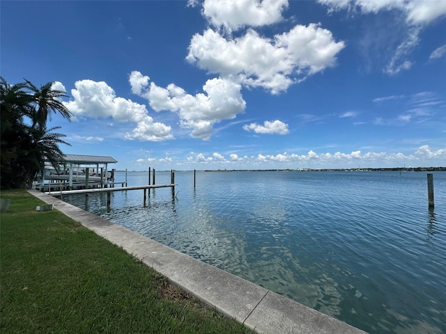 413 Midway Is, Clearwater Beach, FL 33767 - dock area featuring a water view and boat lift