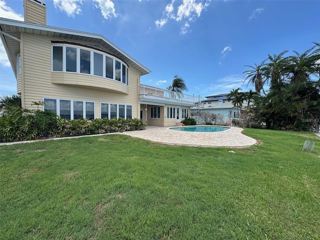 413 Midway Is, Clearwater Beach, FL 33767 - back of property featuring a chimney, a patio, a yard, and an outdoor pool