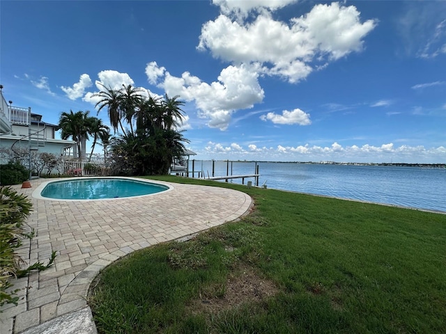 413 Midway Is, Clearwater Beach, FL 33767 - outdoor pool with a yard, a water view, a patio area, and a dock