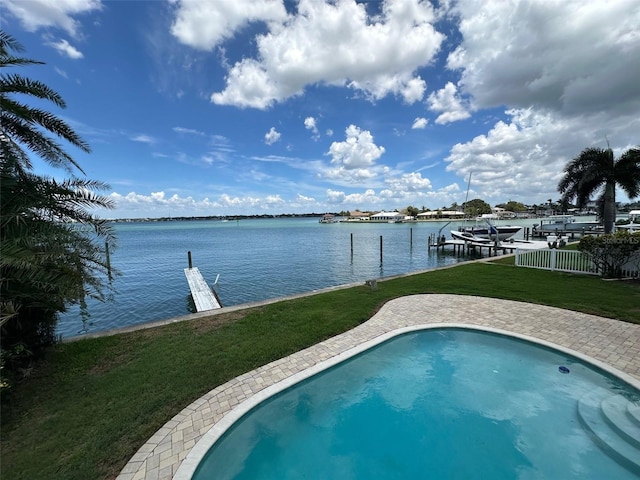 413 Midway Is, Clearwater Beach, FL 33767 - outdoor pool featuring a dock, a water view, and a yard