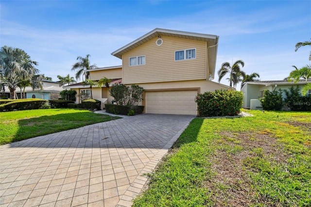 413 Midway Is, Clearwater Beach, FL 33767 - view of front facade with a garage, stucco siding, decorative driveway, and a front lawn