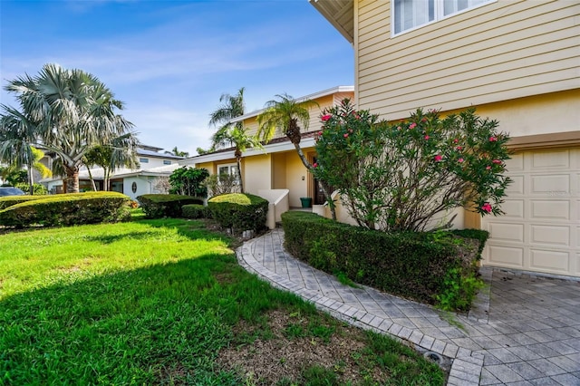413 Midway Is, Clearwater Beach, FL 33767 - view of grassy yard with a garage