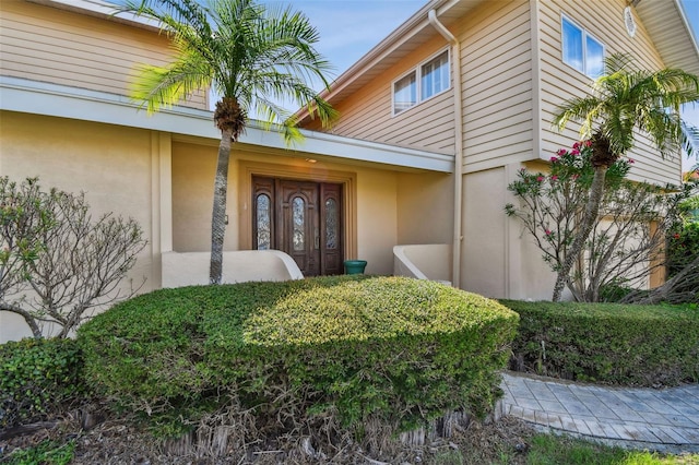 413 Midway Is, Clearwater Beach, FL 33767 - entrance to property featuring stucco siding