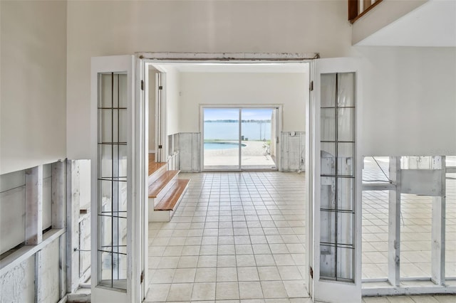 413 Midway Is, Clearwater Beach, FL 33767 - corridor featuring light tile patterned floors and a water view