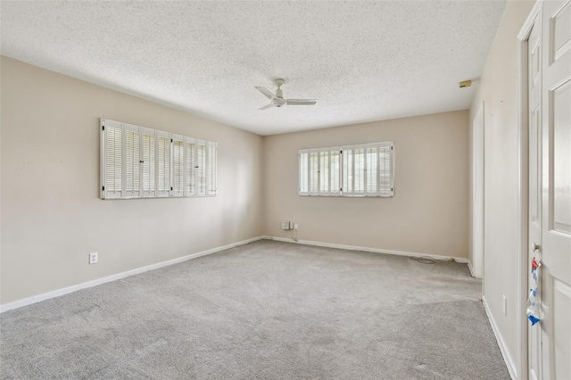 413 Midway Is, Clearwater Beach, FL 33767 - spare room featuring ceiling fan, carpet flooring, and a textured ceiling