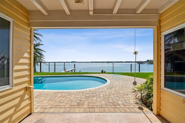 413 Midway Is, Clearwater Beach, FL 33767 - outdoor pool featuring a water view and a patio area