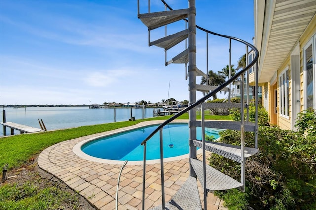 413 Midway Is, Clearwater Beach, FL 33767 - outdoor pool featuring a water view, a patio, and a yard