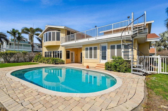 413 Midway Is, Clearwater Beach, FL 33767 - back of house with a balcony, a patio, and entry steps