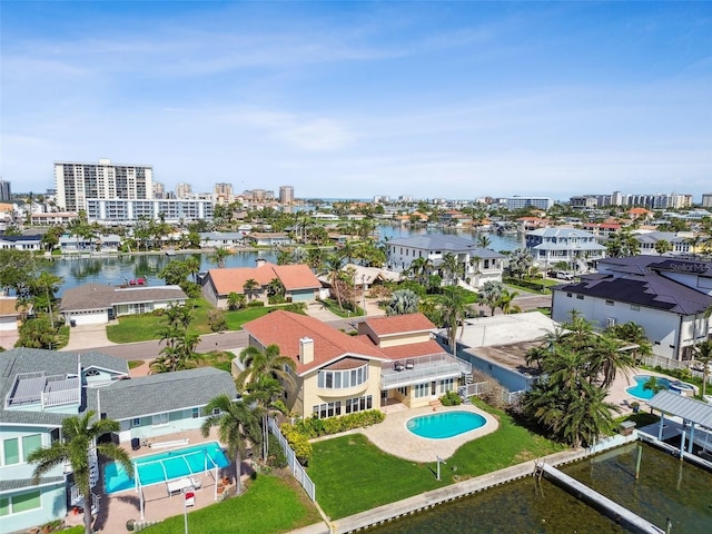 413 Midway Is, Clearwater Beach, FL 33767 - drone / aerial view of a pool and a nearby body of water