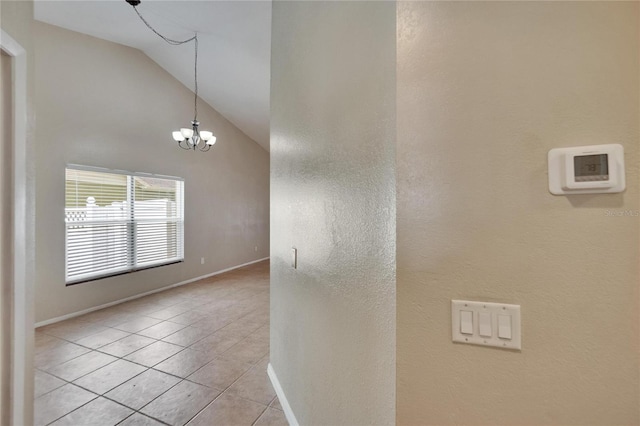 1331 Coolmont Dr, Brandon, FL 33511 - spare room with lofted ceiling, light tile patterned floors, a chandelier, and a textured wall