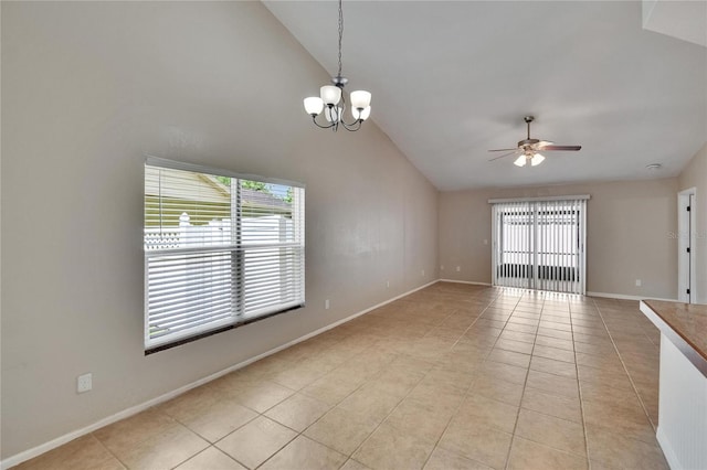 1331 Coolmont Dr, Brandon, FL 33511 - empty room with vaulted ceiling, ceiling fan, light tile patterned floors, and a chandelier