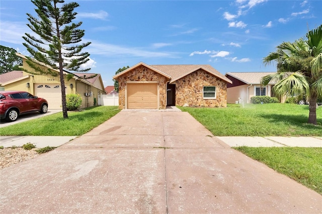 1331 Coolmont Dr, Brandon, FL 33511 - single story home with stone siding, a garage, and driveway
