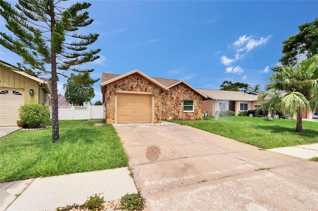 1331 Coolmont Dr, Brandon, FL 33511 - ranch-style home with stone siding, driveway, and a garage