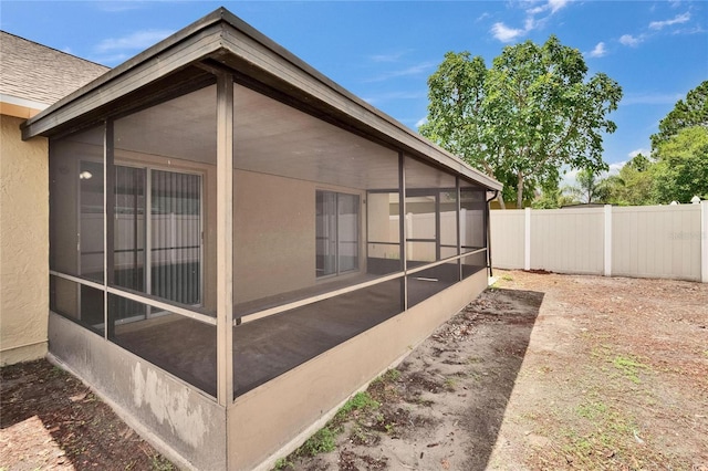 1331 Coolmont Dr, Brandon, FL 33511 - view of property exterior featuring a sunroom and stucco siding