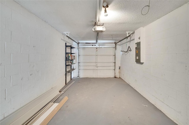 1331 Coolmont Dr, Brandon, FL 33511 - garage featuring a garage door opener, concrete block wall, and electric panel