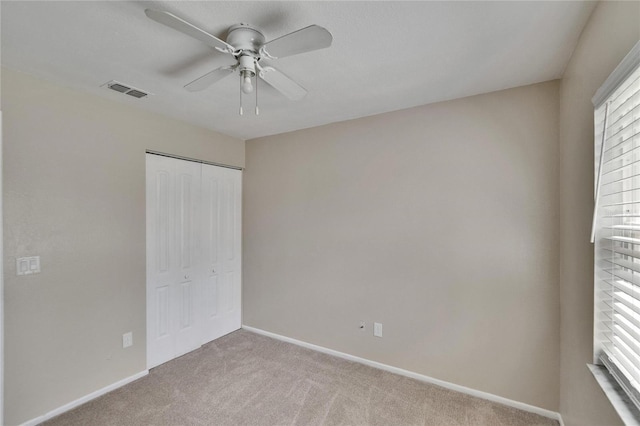 1331 Coolmont Dr, Brandon, FL 33511 - unfurnished bedroom featuring carpet, a closet, and a ceiling fan